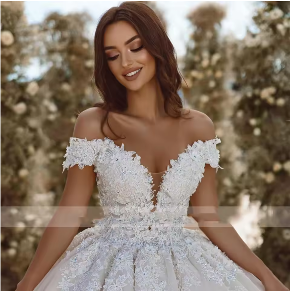 Woman wearing a white lace wedding dress with a blurred natural background