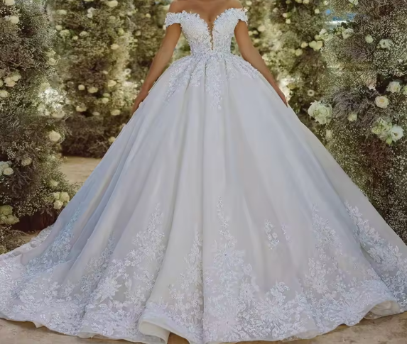 White wedding dress with lace details against a floral backdrop