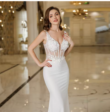 Woman wearing a white lace dress in an elegant indoor setting